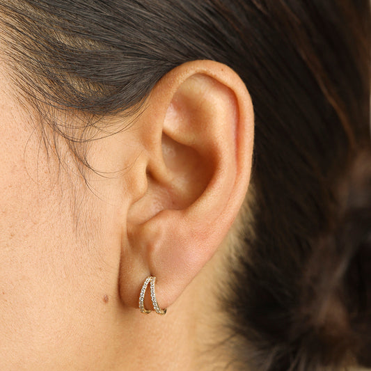 Huggie earrings with pavé diamonds in gold