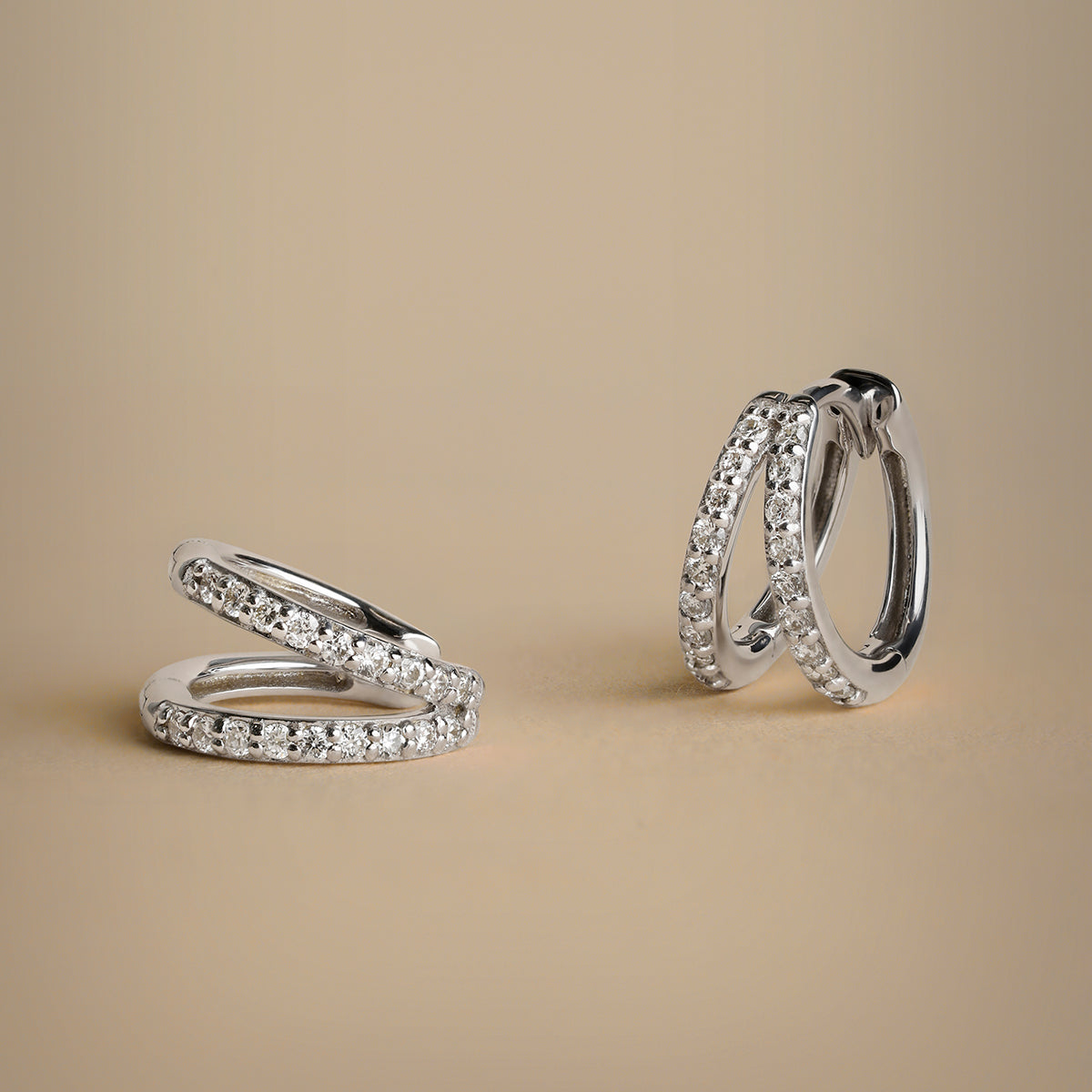 Huggie earrings with pavé diamonds in solid white gold